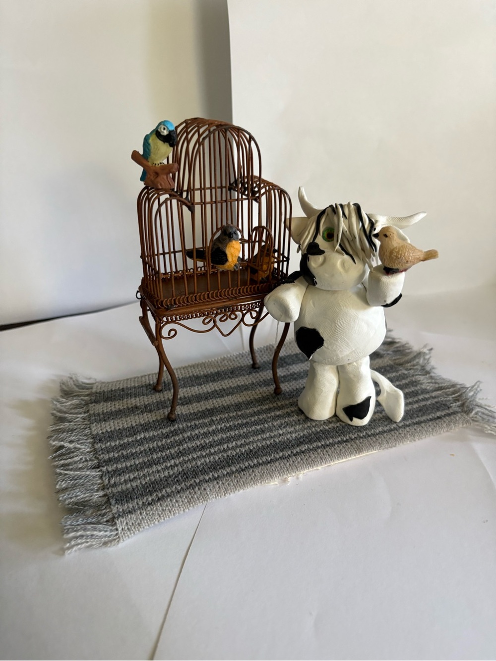 Handmade White & Black Cow with a house full of  Bird
